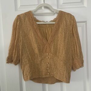 Mustard yellow blouse with lace and button details